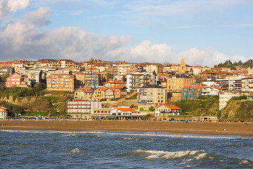 Image showing Beach in the village color houses in blue sky