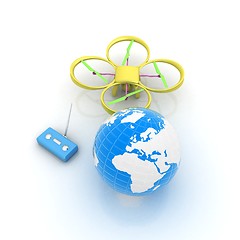 Image showing Quadrocopter Drone with Earth Globe and remote controller on a w