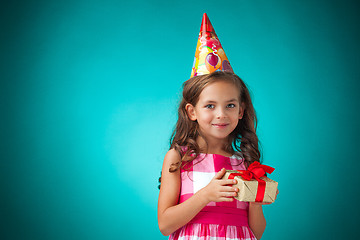 Image showing The cute cheerful little girl on blue background