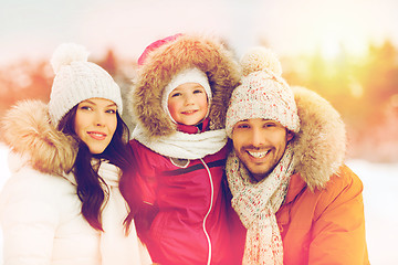 Image showing happy family with child in winter clothes outdoors