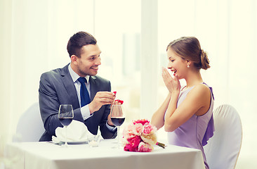 Image showing man proposing to his girlfriend at restaurant