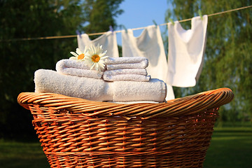 Image showing Wicker basket with laundry