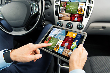Image showing close up of man with tablet pc in car