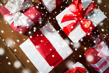 Image showing close up of gift boxes on wooden floor from top