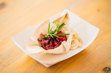 Image showing close up of dough cornet with beetroot filling