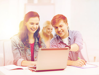 Image showing students with laptop and notebooks at school