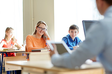 Image showing group of students with books writing school test