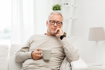 Image showing senior man with cup of tea at home