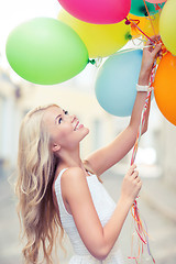 Image showing woman with colorful balloons