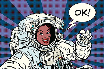 Image showing OK gesture woman astronaut in a spacesuit