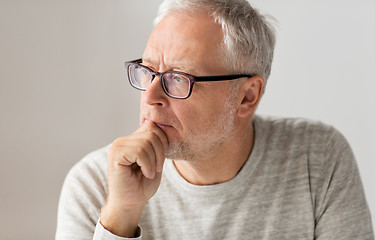 Image showing close up of senior man in glasses thinking