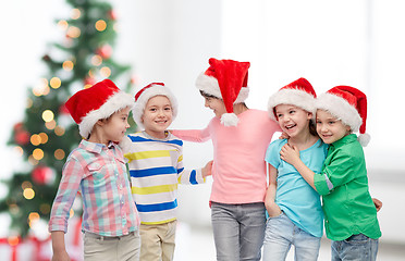 Image showing happy little children in christmas santa hats