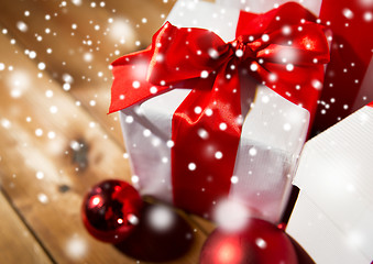 Image showing close up of gift boxes and red christmas balls