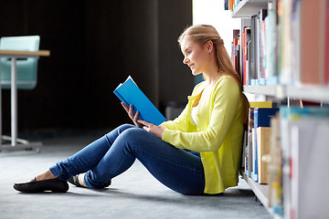 Image showing high school student girl reading book at library