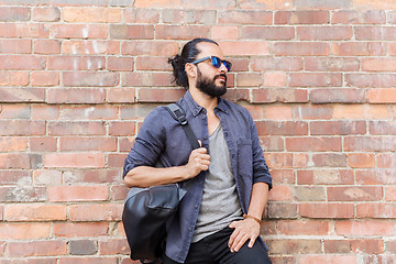 Image showing happy man with backpack standing at city street