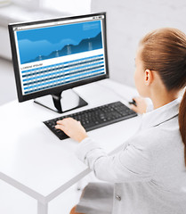 Image showing businesswoman with graphs on computer at office