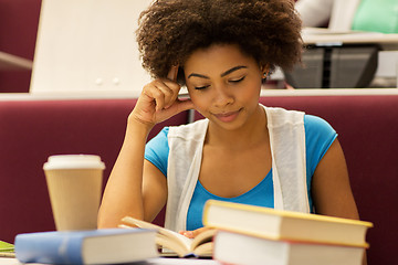 Image showing student girl with books and coffee on lecture