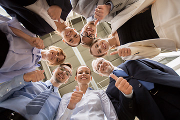 Image showing business people snowing thumbs up at office