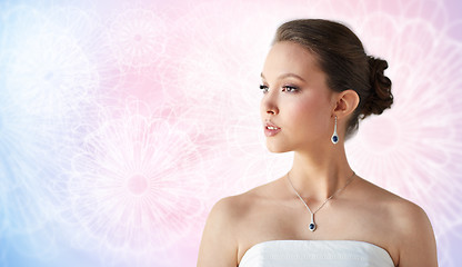 Image showing beautiful asian woman with earring and pendant