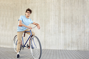 Image showing young hipster man riding fixed gear bike