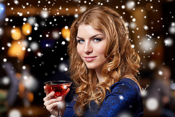 Image showing glamorous woman with cocktail at night club or bar
