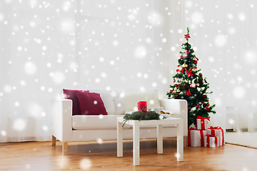 Image showing sofa, table and christmas tree with gifts at home