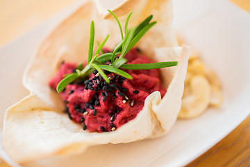 Image showing close up of dough cornet with beetroot filling