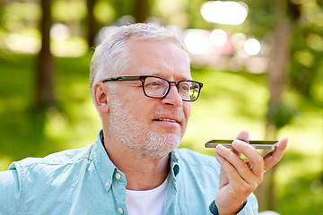 Image showing old man using voice command recorder on smartphone