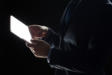 Image showing close up of businessman with transparent tablet pc