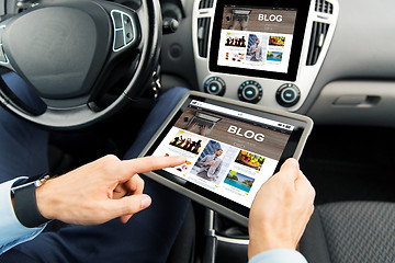 Image showing close up of man with tablet pc in car