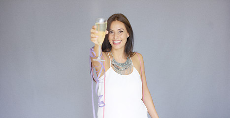 Image showing Beautiful chic young woman toasting the New Year