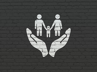 Image showing Insurance concept: Family And Palm on wall background