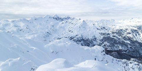 Image showing Freeride snowboarder on the top of the mountain.