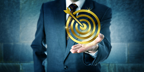 Image showing Manager Showing A Golden Target Icon In Open Palm