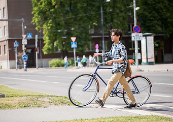 Image showing young man with fixed gear bicycle on crosswalk
