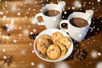Image showing cups of hot chocolate with marshmallow and cookies