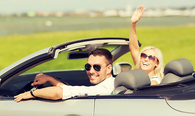 Image showing happy man and woman driving in cabriolet car