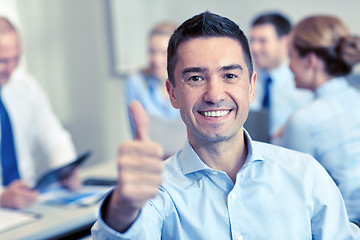 Image showing group of smiling businesspeople meeting in office