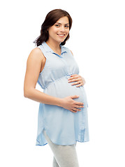 Image showing happy pregnant woman touching her big belly