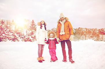 Image showing happy family with child in winter clothes outdoors