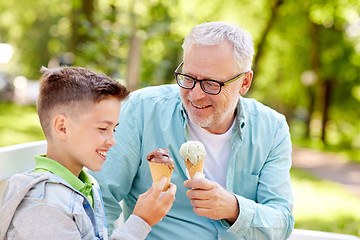 Image showing old man and boy eating ice cream at summer park