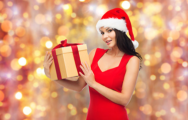 Image showing beautiful sexy woman in santa hat with gift box