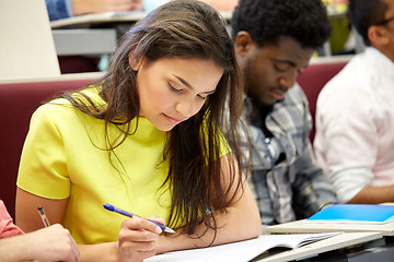 Image showing group of international students writing at lecture