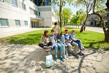 Image showing group of students with notebooks at school yard