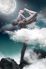 Image showing Couple of ballet dancers posing over gray fantasy background