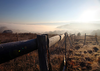 Image showing sunrise with fog over field
