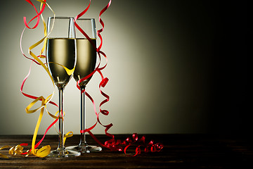 Image showing Two filled champagne glass with festive decoration