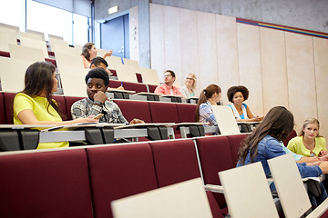 Image showing group of students with notebooks at lecture hall