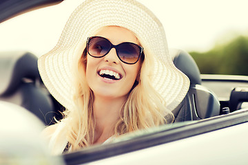 Image showing happy woman driving in cabriolet car