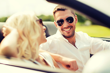 Image showing happy man and woman driving in cabriolet car